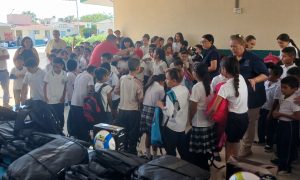 Cabo Kids receiving their backpacks